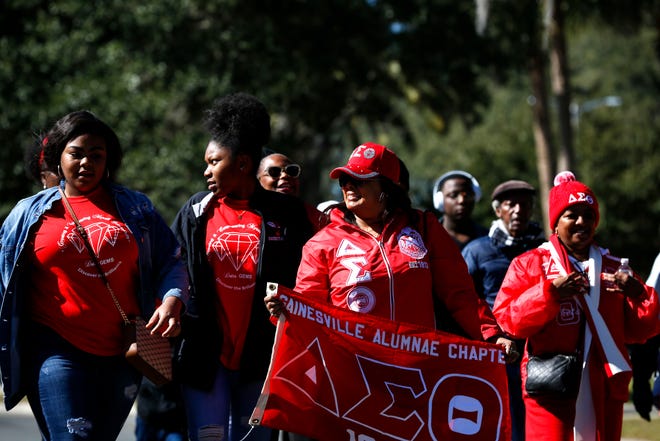 Members of the Gainesville Alumnae Chapter of Delta Sigma Theta participate in the 2020 King Celebration march in Gainesville, Fla. on Jan. 20, 2020. [Sam Thomas/The Gainesville Sun]