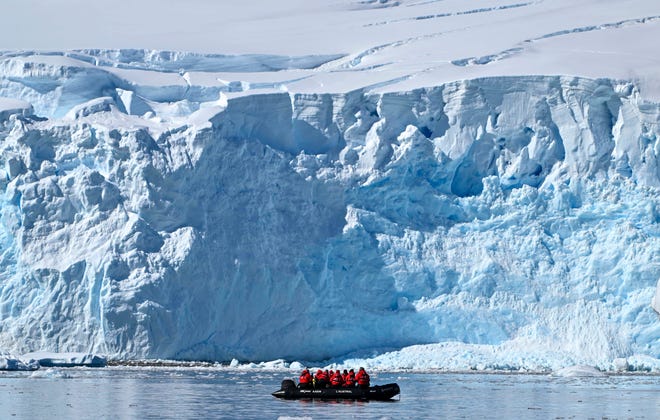 January 15, 2024: Tourists on a dingy of the cruise ship L'Austral visit the Gerlache Strait -which separates the Palmer Archipelago from the Antarctic Peninsula.