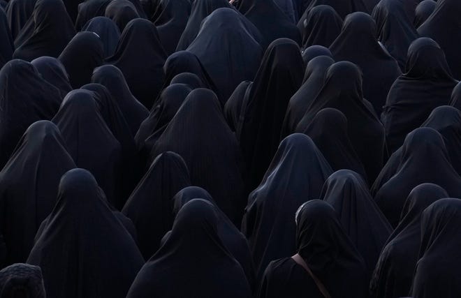 January 22, 2024: Women attend the funeral ceremony of Iranian Revolutionary Guard members who were killed in an air strike in Syria, in Tehran, Iran. An Israeli strike on the Syrian capital on Saturday destroyed a building used by the Iranian paramilitary Revolutionary Guard, killing at least five Iranians, Syrian and Iranian state media reported.