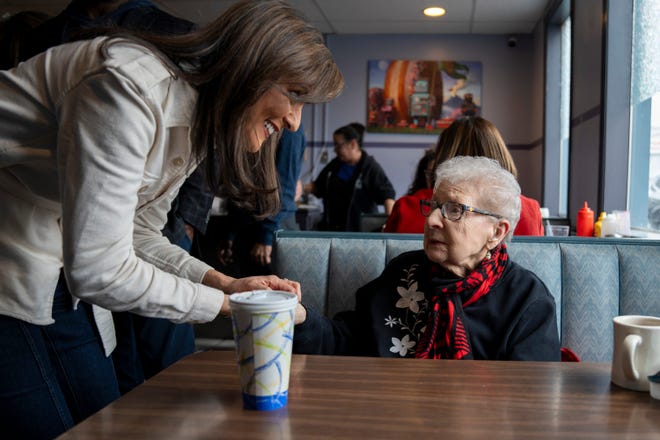 January 23, 2024: Republican presidential candidate Nikki Haley shakes hands with Georgette Georgi Hebert from Bedford, N.H., at Chez Vachon diner in Manchester, N.H., during the New Hampshire presidential primary.