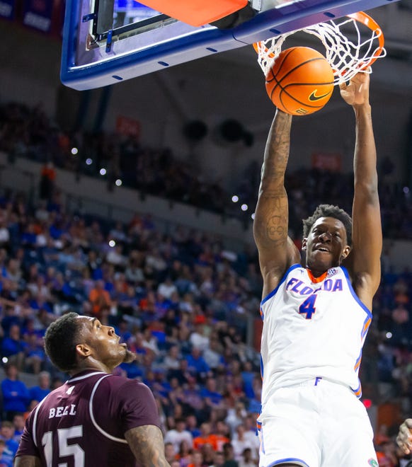 Florida Gators forward Tyrese Samuel (4) slam dunks the ball in the first half as Mississippi State Bulldogs forward Jimmy Bell Jr. (15) can only watch. The Florida men’s basketball team hosted the Mississippi State Bulldogs at Exactech Arena at the Stephen C. O’Connell Center in Gainesville, FL on Wednesday, January 24, 2024. [Doug Engle/Ocala Star Banner]