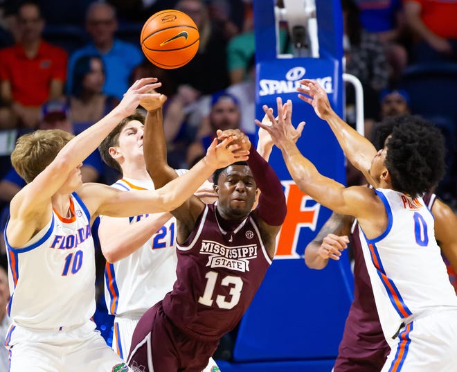 Mississippi State Bulldogs guard Josh Hubbard (13) loses the ball to the Gators in the first half. The Florida men’s basketball team hosted the Mississippi State Bulldogs at Exactech Arena at the Stephen C. O’Connell Center in Gainesville, FL on Wednesday, January 24, 2024. [Doug Engle/Ocala Star Banner]