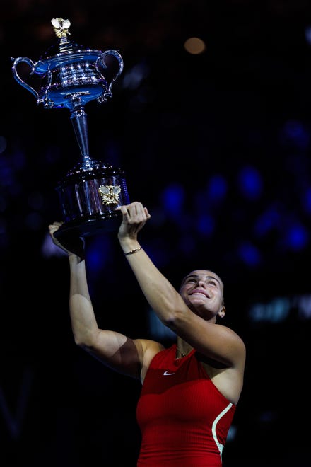 January 27, 2024: Aryna Sabalenka of Belarus poses with the Daphne Akhurst Memorial Cup after beating Qinwen Zheng of China in the final of the women’s singles at the Australian Open in Melbourne, Victoria, Australia.