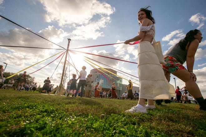 Faire-goers enjoy the may pole during the annual Hoggetowne Medieval Faire at Depot Park in Gainesville, FL on Saturday, January 27, 2024.