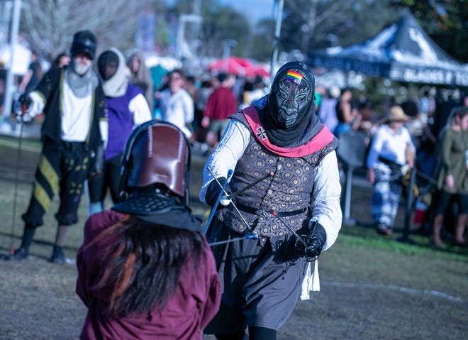 Re-enactors battle with swords during the annual Hoggetowne Medieval Faire at Depot Park in Gainesville, FL on Saturday, January 27, 2024.