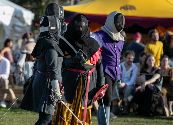 Re-enactors prepare to battle with swords during the annual Hoggetowne Medieval Faire at Depot Park in Gainesville, FL on Saturday, January 27, 2024.