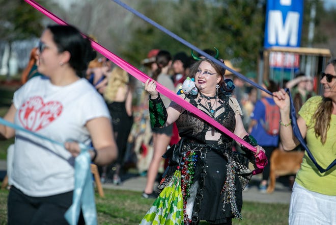 Faire-goers enjoy the may pole during the annual Hoggetowne Medieval Faire at Depot Park in Gainesville, FL on Saturday, January 27, 2024.