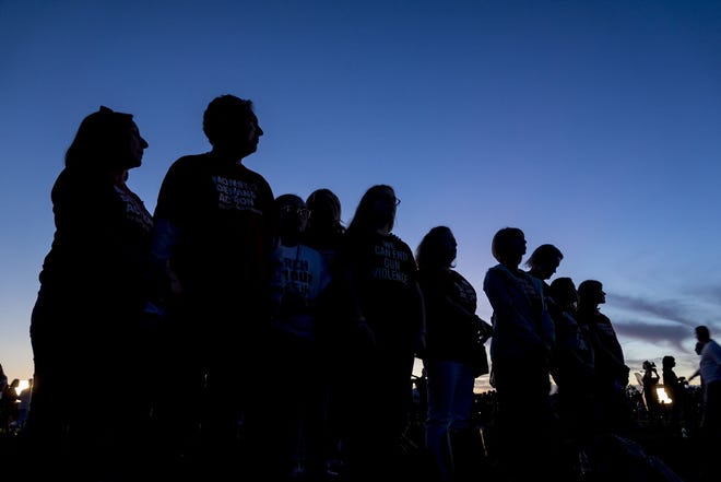 An interfaith ceremony honoring the memory of those who lost their lives at MSD High School last year, Thursday evening inside Pine Trails Park, in Parkland, Florida. [RICHARD GRAULICH/palmbeachpost.com]
