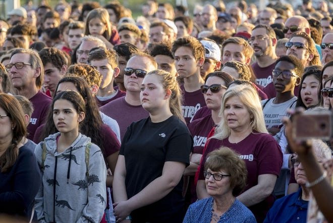 An interfaith ceremony honoring the memory of those who lost their lives at MSD High School last year, Thursday evening inside Pine Trails Park, in Parkland, Florida. [RICHARD GRAULICH/palmbeachpost.com]
